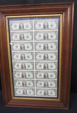 244. Framed sheet of 16 one-dollar notes, series 1981